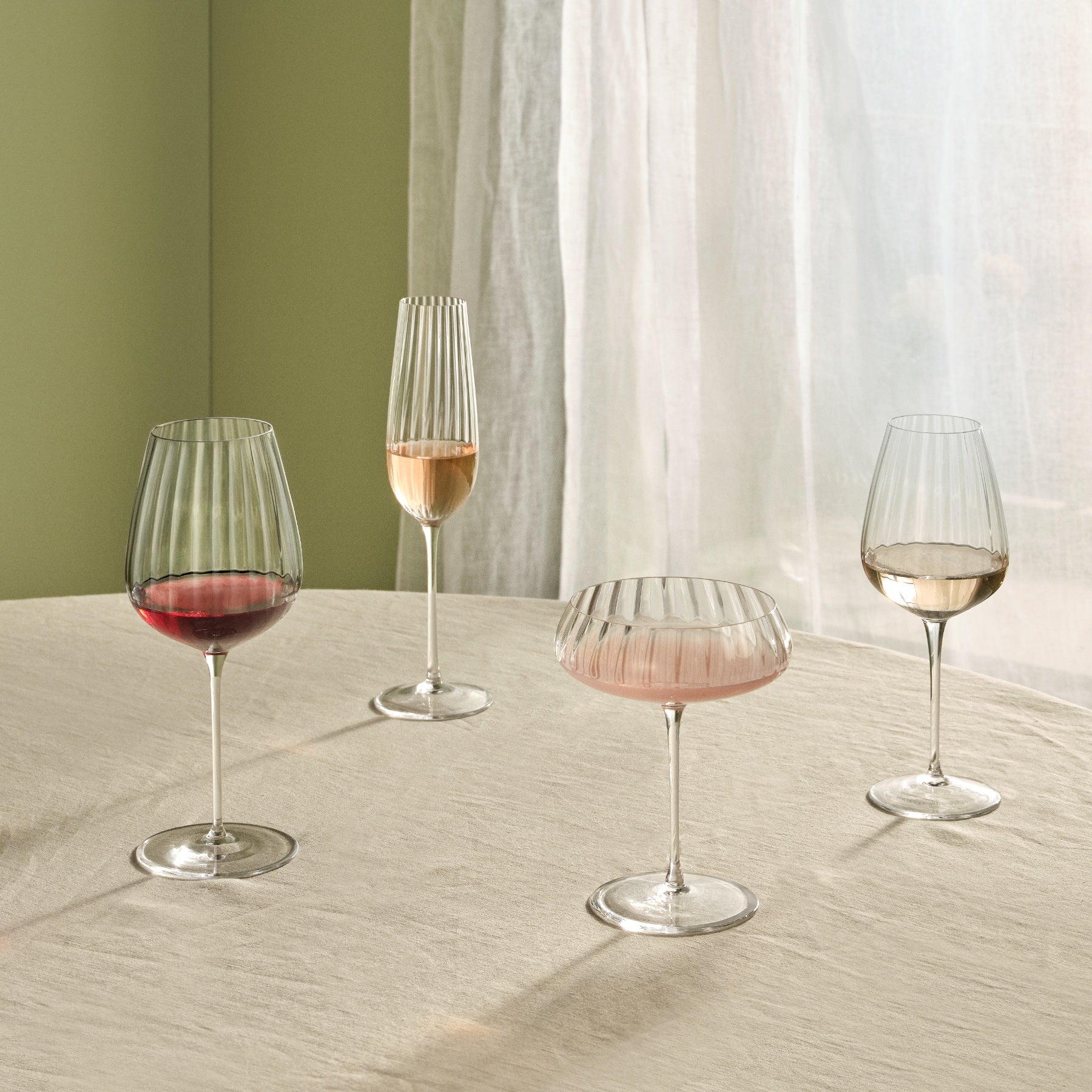 http://www.2modern.com/cdn/shop/files/nude-glass-round-up-white-wine-glass-set-of-2-view-add01.jpg?v=1695700281